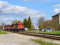 Switching the yard lead and sandwiched between Cobourg lane and Kent St, L568 with a trio of GP9's is working on their set off in Stratford yard while the town and railway seem integrated, not separated. Believe it or not the foreground track is the Guelph subdivision mainline, and just to the far left is Stratford West where the GEXR Goderich sub branches off. A quaint scene reminiscent of many branchline towns north of here, long gone. Fencing and other safety measures are sure to eliminate the rural look of this scene in due course - it's already happened in Guelph and Kitchener.