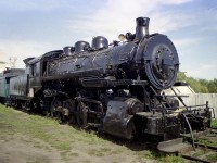 It has been a long time so I do not recall exactly where the Strathcona Restoration facility was. South Edmonton along Hwy 2 I think it was back then. However, I did stop and grab a photo of an old steam engine coupled up to Intercolonial baggage car #236, which is what caught my attention in the first place. In 1970 this steam engine went to the Alberta Railroad Museum in North Edmonton. Eventually it was then sold.  After many years, in 1998 the old CP 0-8-0 steam came to rest down near the ghost town of Sandon, BC; I gather on the outskirts of Kaslo; where it is on permanent historical display and kept in reasonable condition (non-operational, of course). The steam engine was built in 1908 by MLW as 2-8-0 #1737 but went thru a rebuild @1928 as an 0-8-0. Interesting it cost new $18,422 CDN  back in 1908 and now $250,000 has been put into it for restoration. Great comparison of how the dollar has changed over the years.