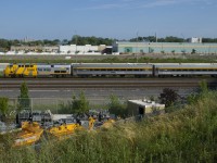 VIA 28 has a pair of refurbished business class cars up front as it heads towards Central Station. VIA's stainless steel cars such as these had been completely absent from the Quebec City-Windsor corridor for over a year; with an increase in service frequency a few weeks back they have made a comeback.