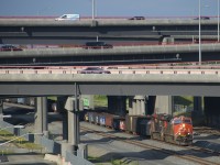 CN 321 is passing underneath the rebuilt Turcot interchange with CN 2906 & CN 3865 for power.