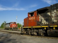 Widecab geeps faceoff as parked CN 9454 and CN 4802 meet, with the former parked and the latter on CN 536.