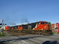 The GE's let out some smoke as a 612-axle long CN 120 crosses Courcelle Street with IC 2717, CN 2640 & CN 5649 up front and CN 2318 mid-train.