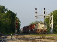 It's quite early in the morning as CP 253 is approaching Lasalle Yard with Navy unit CP 7022 leading CP 8155 & CP 8566. A late edition of counterpart CP 252 had just left here five minutes earlier after holding for a boat going through the St. Lawrence Seaway.