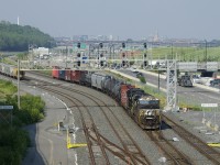 CN 529 has NS 7710, recently rebuilt NS 4490 and only 14 cars as it passes Turcot Ouest. Normally into Montreal very early in the morning, this one arrived later in the afternoon for unknown reasons.