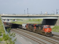 CN 321 has the usual gons behind a single hopper as it heads west with CN 2885 & CN 3120 for power.