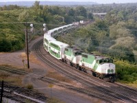 While looking over this photo, I found it so hard to believe that these two GO locomotives, 709 and 702; became part of the CN fleet 30 years ago already, (CN 9676 and 9671) Trailing is APCU 903, formerly ONR's FP7A 1512. I liked the angle here but often chose a different location due to all those wires cluttering up the scene.
In the background in this photo I see a few of the lads hanging out at Bayview Jct. As usual.