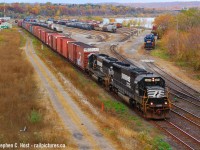 It's Halloween 2004, and on an overcast Sunday morning I find myself at Bay St to record the passage of NS 328. It's really quiet, not even the RLHH Hamilton yard jobs are working today. Powering the train is a matching pair of unrebuilt SD60's, built for NS in the mid 80's. At least one of these has been rebuilt into a SD60E. The time is 10:12 and I'd shoot these guys again by my Dad's place in Winona at 10:33. Checking my photos, an hour or so later I went to Burlington West Station to record the passage of 550, CP 167 (6037 east with 4 SD's and 3 CEFX AC4400's on delivery from GE Erie), and lastly CN 382 which was CN 6023/BNSF 525/BNSF 2175. I don't remember anyone else out to record these with me!