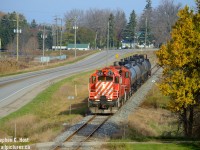 To me, this is classic CP on the St. Thomas Subdivision. While I did spent time on the mainline in the early to mid 2000's, the branchlines called me quite often and I was often one of the few photographers that ventured down the St. Thomas Sub to regularly catch the action. You either found the Frame Train, one of the twice daily CAMI turns, or a St. Thomas (Putnam) turn which ran I think 5 days a week. Furthermore, a pair of GP9's were common on most trains, anything else was actually a bit of a rarity (GP40's, 38's, but they did regularly cycle through).Basically, if you told someone who was last here 15 years ago nothing had changed, and they stared at this picture, they'd be none the wiser. But, it is the Ontario Southland Railway :)