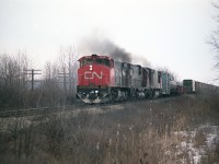 Just another CN powered train, but this is more like a 'blast from the past'.   CN 2542  (M-420(W) was renumbered to 3542 in 1987, later sold to Hudsons Bay Rwy;  2006   C-630M (retired 1992) and  2117  (BBD H616 retired 1997, sold to NRE)make up the power for this train. This scene was captured from Pettit Rd in Fort Erie as the train accelerated away from CN Duff at west end of the yard.
The BBD locomotive only last 15 years, having been built in 1982.