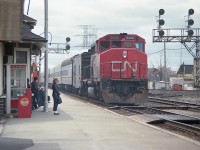 There were a few low numbered GP40-2L(w) locomotives on CN geared for 80MPH and they fit right in helping out VIA when necessary. Here we see CN 9430, with steam jenny behind, slowing in for a stop at Burlington West station. The woman in the photo looking over sure doesn't seem to approve of me. Not a problem, believe the feeling is mutual. I was there for the train. Besides, CN 9430 was sold to ALSTOM in 2001 and I'll bet she still looks pretty good.