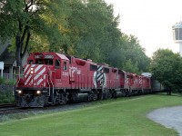 Just another day in what was my personal paradise back then.  CP coming over from the States, rumbling thru the NF tourist district and then past me at the South Siding Switch Montrose on its way to Toronto. The sun is setting, and you can see indications of that on the left high up in the trees. Lighting was often very tricky in town.
With the removal of the track thru the city in the early 2000s, this location is now just a switch back for the Chippawa local to access industry in the area. Just as well. In the continual desire to rake in more money, the city of Niagara Falls has imposed "No Stopping" on the open pull-off area here. Heaven forbid somebody should be able to park anywhere for free !!!
Power on this train is CP 3060, 3090, 8205 and 8243. First two units still on CP roster, second pair are not.