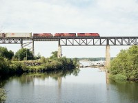 Scenic early morning view taken from the diminutive old CN bridge that used to support local traffic some years ago (now a rail trail). CP 9114, 9100 and 9546 are seen northbound (TT west) over the landmark trestle which spans the Parry Sound harbour area. I've always enjoyed shooting here despite the very limited window of favourable sun most mornings.
Many of the 9100 series SD90MACs were upgraded to 7000 series SD70ACU in 2019, the rest to follow in 2020 save for one done as #6644 commemorating 75th anniversary of D-Day.