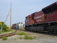 Counterparts and SD70ACU's meet as CP 142 with CP 7045 leading passes CP 143 with Air Force unit CP 7023 leading. The latter is stopped here with engine issues on the leader.