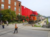 The brakeman and conductor flag the Charlevoix Street crossing after the Pointe St-Charles Switcher pulled 5 grain empties from Ardent Mills.