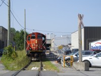 The Pointe St-Charles Switcher is shoving a single boxcar towards Kruger, located at the end of the Turcot Holding Spur. To the right of CN 4141 is a sign that says "Spot #1 Plastic Car". There is a second client (Imaflex) who occasionally receives a car at that location.