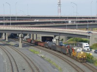 CN 321 has an ex-Citirail leader (CN 3922), along with CN 3838 & 121 cars as it emerges from the Turcot interchange during the evening rush hour.