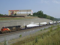 After getting a new crew onboard, windmill train CN X319 is departing Turcot Ouest. The blades are built by LM Wind Power Canada in Gaspé, Quebec.