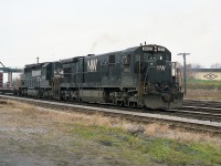 It has been quite a while since I have seen a locomotive lettered for the N&W in Fort Erie. In this view N&W 8012 is leading NS 2329 with what I must assume was a transfer heading for Buffalo.  The N&W C30-7 is one of 79 that were on the roster, 8003-8082,  and the last of the series was retired by 2001.  The Central Av bridge in the background is for ID purposes. :o)