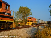 A meet in the countryside as two GEXR trains on the Guelph Junction Railway pass each other in Arkell, Ontario. Engr. Snook waves to his colleagues on 583 who have taken the siding and will perform an inspection for safety as 582 passes.