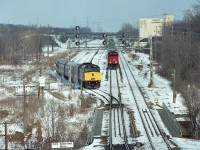 An unusual move by VIA I had not seen before. CN 5260 and 5149 holding with a westbound train, waited for #73 with VIA 6416 to come up the south track (on right) then reverse over two tracks and back into the Aldershot lead as seen here. I shot this as it was in the process of reversing in order to wait for signal. It then got its' light after the crossover at bottom was closed and it headed westbound ahead of the freight.

Must have been maintenance work ahead on the South track.