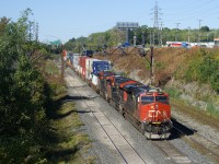 CN 120 is passing under a vintage signal bridge as it exits Taschereau Yard with a trio of GE's up front (CN 2871, CN 3066 & CN 2902).