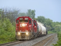 After switching StyroChem on the Baie-D'Urfé Spur, CP F95 is heading to Dorion to run around its train before heading back to St-Luc Yard. Power is CP 3037 and CP 4417.