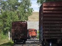 After leaving an empty on the siding (at left), CN 4141 gets ready to shove a load (at right) towards Kruger.