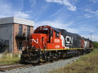 After waiting for CN 120 to pass, the Pointe St-Charles Switcher with GTW 6226 & CN 4141 for power has its signal so that it can leave the East Side Canal Bank Spur after dropping off grain cars at Ardent Mills