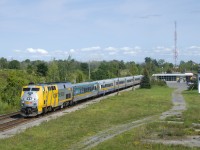 VIA 67 is departing Cornwall Station with VIA 913 and six LRC cars. 