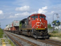 CN 106 has CN 8942 and another SD70M-2 on the tail end (CN 8014) as it passes through Dorval Station.