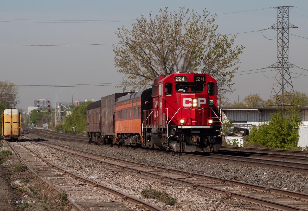 CP 2241 leads the Track evaluation train through Dixie at trackspeed with a Milwaukee Road passenger coach.