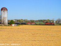 This could be 1993 with what looks like a very short train rolling by farms in Puslinch, Ontario, but it's 2021. I'll take it.