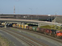 After doing work at Pointe St-Charles Yard, CN 527 is on its way to Taschereau Yard with CN 3251 & CP 8827 for power. Up front are 5 MGLX cars.