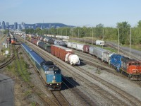 CN 322, VIA 622 and CN 522 are all seen at Southwark Yard on a sunny morning. VIA 622 is heading towards Quebec City with VIA 6428 and a Renaissance consist. CN 522 is getting ready to leave the north side of Southwark Yard before departing for Saint-Jean-sur-Richelieu. CN 322 is about to grab its DPU before heading to the yard office light power.