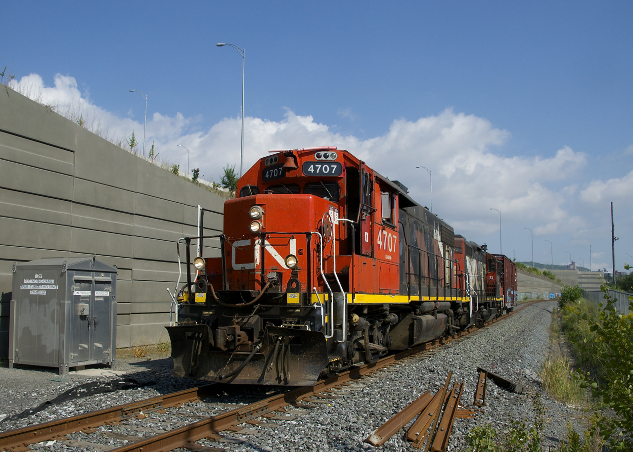 The Pointe St-Charles Switcher has a single boxcar for Kruger as it passes along a section of the Turcot Holding Spur that was completely rebuilt when the nearby Turcot Interchange was replaced over the past few years.