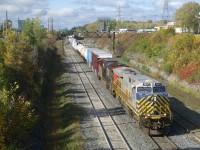 Still in Citirail paint, CN 3937 leads CN 324 out of Taschereau Yard, with CN 2971 trailing.