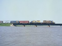 The paint on ONR 1733 and 1734 looks rather tired on these units leading an eastbound train over the Frederickhouse River. This movement is returning to Englehart from the Kidd Mine area. The line used to go as far as Timmins, but no more. It has been over 20 years since this image. Interesting the CTG states both SD40-2 locos are still working for the ONR.