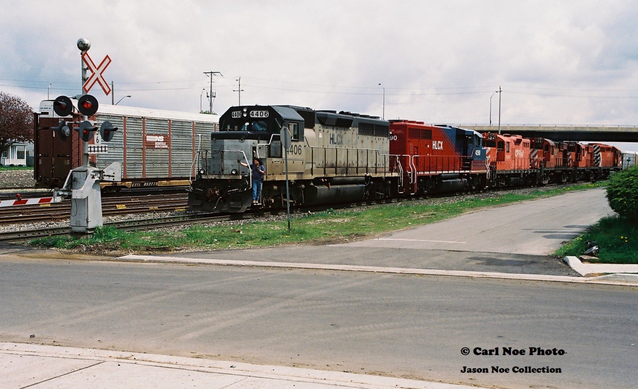 CP 924 reverses to its train approaching the Bond Street crossing in Galt after setting off cars in the once busy yard. The consist included; 5629, 1822, 1861, 8241, HLCX 4290 and HLCX 4406.