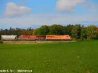 CP 254 with the "Every Child Matters" 8757 eastbound on CP 254 30 minutes ago as it passes through a suckerhole of sun. Thank god, it's been awfully dreary and the fall colours... are incredibly disappointing this year. This certainly makes up for the lack of it :)