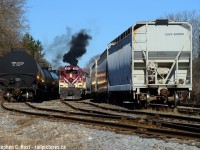 Mid 20th century MLW's meet 19th century rails as Job 2 puffs the good stuff as they drag their train through lower yard. 5 days a week this job ran north in the late afternoon, turned somewhere in Guelph then worked facing the other direction. You didn't always know where they'd turn (sometimes they ran long hood forward to avoid turning) but the fact this ran every day made photography easy, just be there and shoot. This still happens with GEXR - every day.