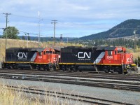 Rolling into the BC town of Williams Lake, I was rather surprised to see these two engines in the yard. I guess because they must be stationed mainly in the west, I was not aware of their existence. According to the Trackside Guide there are 6 of these; GP38-2 models acquired when CN took over the Wisconsin Central in 2001. Series 2001 to 2006. Of course not to be confused with the CN Dash-8s in the 2000 series.  The GPs are sublettered "WC", but still; it threw me off for a bit. I would have thought these would be renumbered.....  Did manage to catch 2003 as well; that one still in Wisconsin Central paint. CN 2002 and 2006 basking in the sunshine.....I hoped for a freight to come into town with a 2006 leading of course, but incredibly remote chance of that.!!