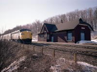 It is pushing the 4 PM hour as train #84 roars eastward by the old station at Dundas.  VIA 6528 appears to have a freshly painted yellow nose. The image is severely backlit with that late day setting sun, but the shot turned out not too bad; and is a good reminder of how Dundas Station used to look. The sun angle for most of the day was reasonably good here, and it made a nice alternative to the same old, same old angles at Bayview Junction back then.