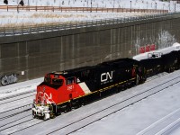 A repainted ES44AC leads CN 305 as it departs Turcot Ouest on a freezing afternoon. It was wrecked in Louisiana in June 2020.