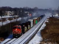 CN 305 is racing west, with CP F95 not far behind on the parallel CP Vaudreuil Sub.