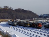 CN 305 with CN 2972, CN 3936 and CN 2597 arranged elephant style is passing the tail end of CN B730. On the tail end of CN B730 is ex-CREX unit CN 3986. At far left on the Freight Track are cars left by a CN 306 that had DP issues.