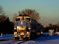 AMT 1345 leads EXO 1207 through the crossovers near CN St-Henri just before sunset.