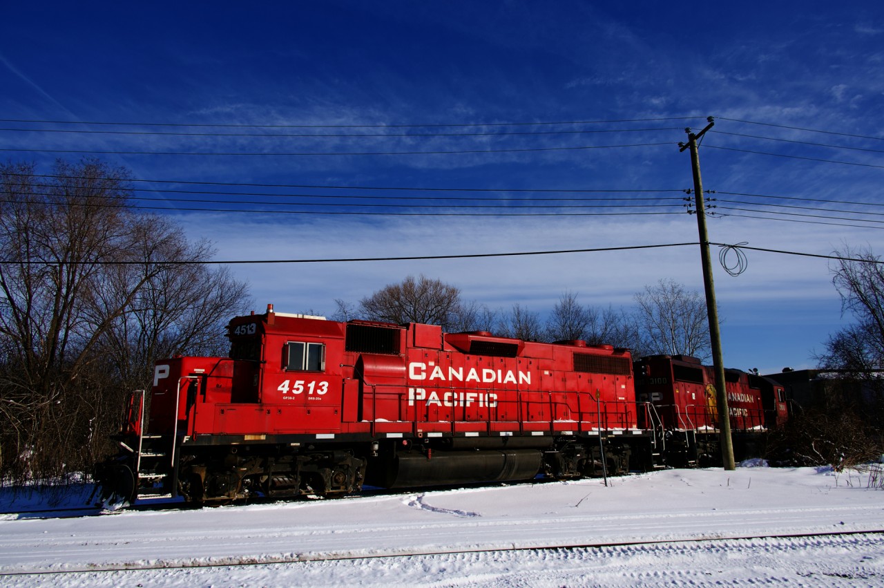 CP F95 with CP 4513 & CP 3100 is switching a Coca-Cola plant that is located just off of the Lachine Industrial Spur.