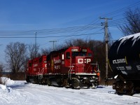 After lifting four empties and spotting two loads at Coca-Cola, CP F95's power (CP 3100 & CP 4513) is coupling back to the rest of its train. It will back up to the main line and then head west.