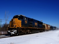 One of only ten SD70ACe-T4's on CSX's roster is the sole power on a 56-car CN 327, seen approaching CN Caron as it kicks up the snow.