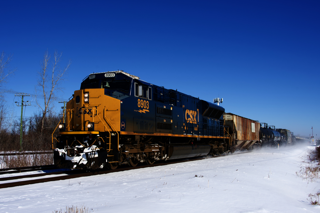 One of only ten SD70ACe-T4's on CSX's roster is the sole power on a 56-car CN 327, seen approaching CN Caron as it kicks up the snow.